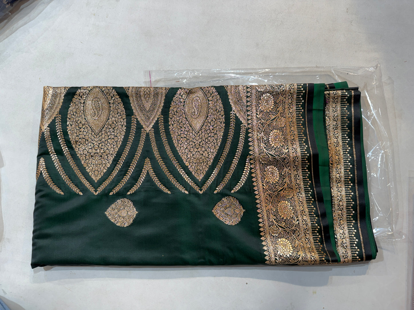 bottle green mashru silk saree with banarasi zari paisley motifs and ornate floral border