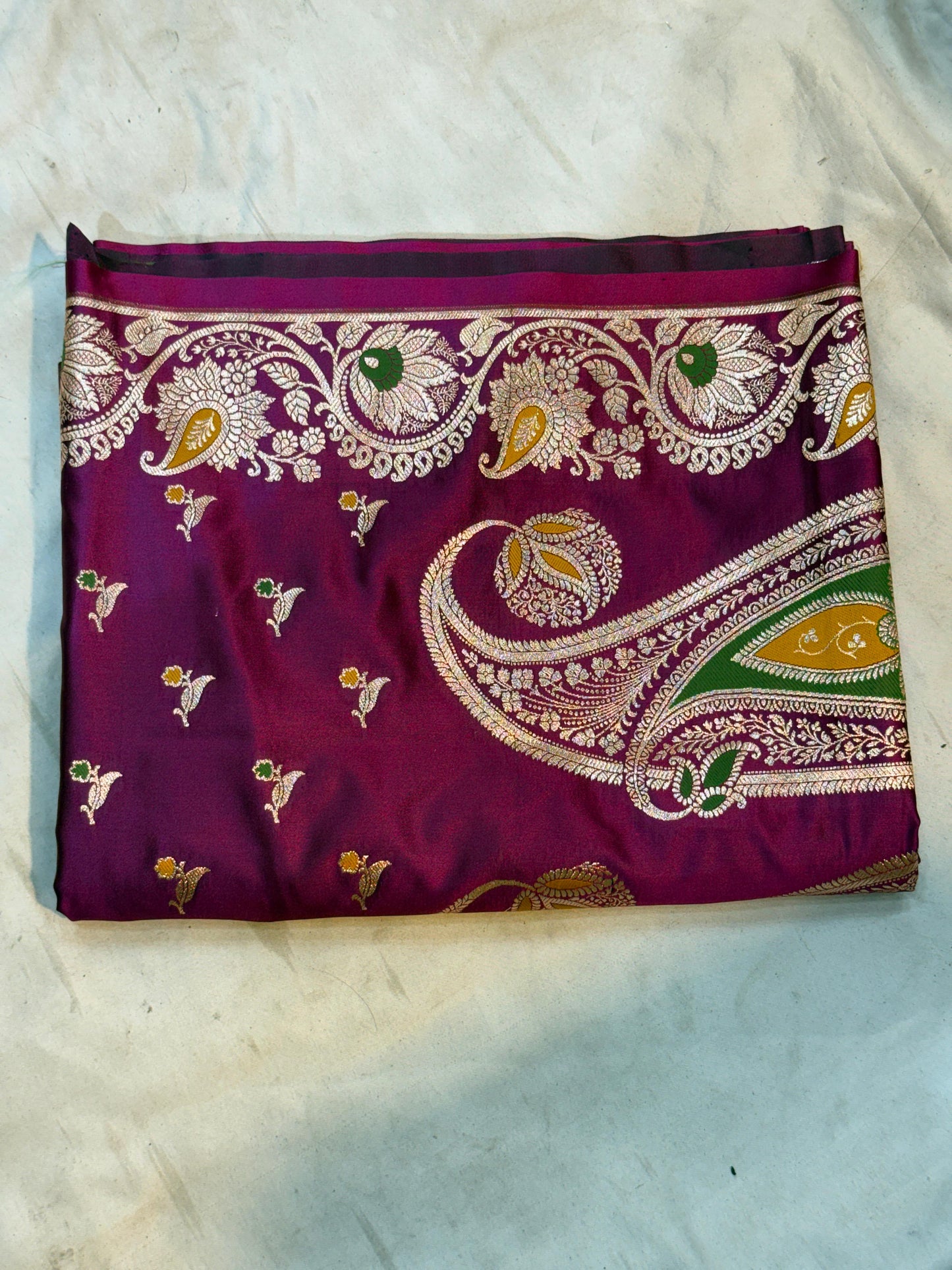 royal magenta katan silk saree with intricate zari motif and paisley border
