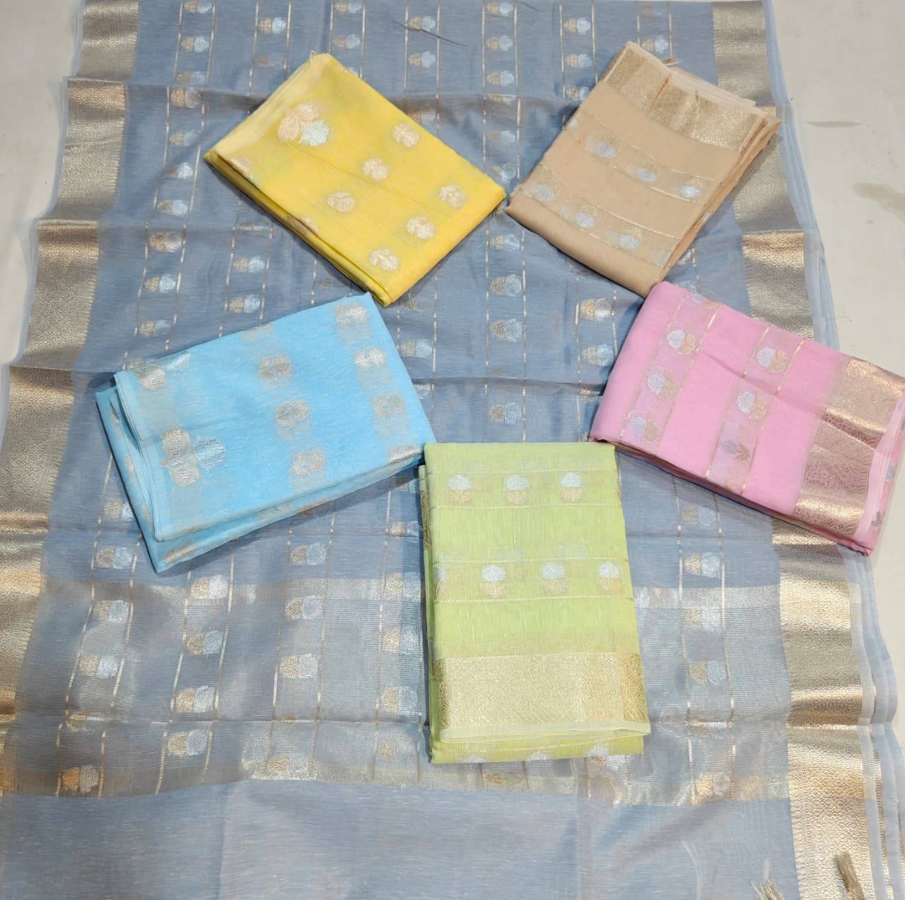 sky blue linen cotton saree with silver zari motifs