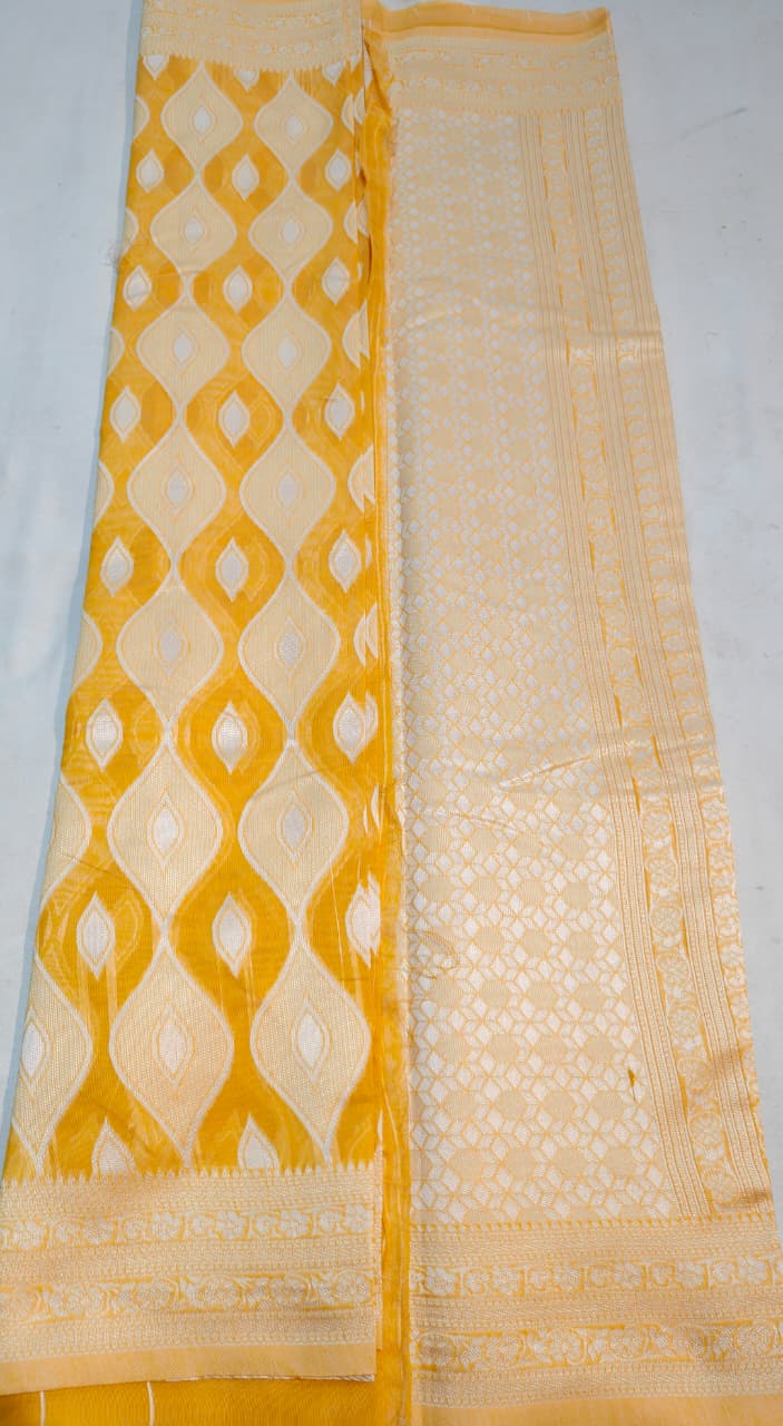 elegant mustard yellow handloom cotton saree with intricate white pattern