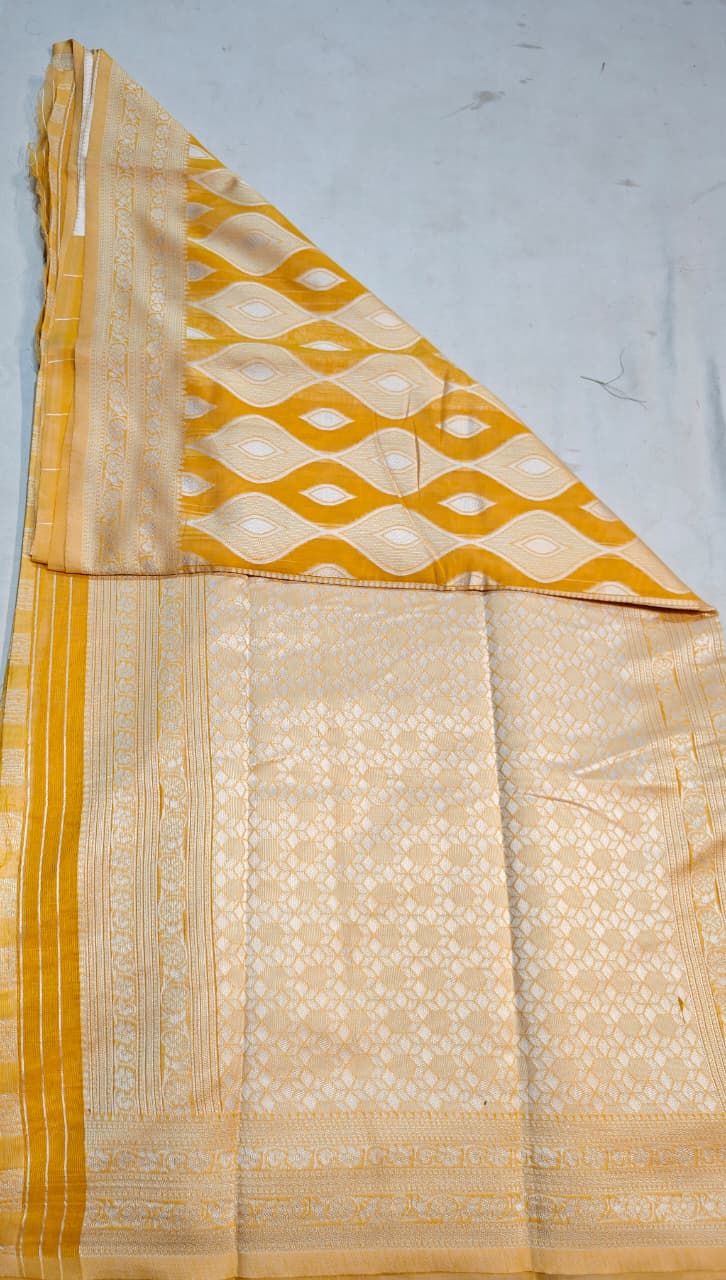 elegant mustard yellow handloom cotton saree with intricate white pattern